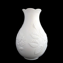 Load image into Gallery viewer, Vintage Rose white bisque flower vase, 635, featuring embossed roses and scalloped edge. Designed by M. Frey for Kaiser, Germany, 1980s. This delicate bottle shaped vase will look stunning in any setting!

In excellent condition, no chips/cracks/repairs. Maker&#39;s mark on bottom.

Measures 4 x 4 x 7 1/8 inches
