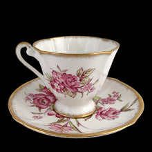 Load image into Gallery viewer, Opposite side view of vintage 1950s Roslyn China Sunningdale teacup and saucer with hand-painted pink florals and gold gilt trim
