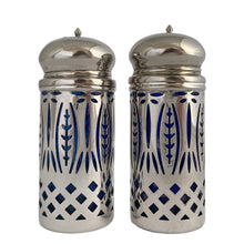 Load image into Gallery viewer, Vintage Avon &quot;Royal Sapphire Collection&quot; cobalt blue glass salt and pepper shakers with silver plated filigree sleeves.  In excellent condition, no chips to the glass. Wear to the lids, see photos.  Measures 1 1/2 x 4 inches
