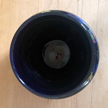 Load image into Gallery viewer, Vintage Royal Stanley Ware cobalt blue redware pottery jardiniere or planter, hand painted with a Clematis vine in shades of blue, purple, yellow, pink and green. Crafted by Colcolough &amp; Co., England, 1919-1931. A lovely addition to your home&#39;s decor.

In excellent condition, no chips/cracks/repairs. Maker&#39;s mark on bottom.

Measures 5 1/2 x 5 inches

