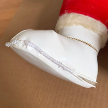 Load image into Gallery viewer, This rare adorable vintage mid-century era large rubber faced Santa Claus stuffed toy features a smiling side eyed face, a sheared velour red suit bordered with white plush trim, black vinyl belt, white velour hands, white vinyl-type blanket stitched boots. Crafted by the Rushton Company, USA, 1950s. A wonderful piece of Christmas nostalgia!

In as found vintage condition. The stitching on the boots have been repaired and could benefit from additional repair. Original tag.

Measures 13 1/2 x 24 1/2 inches
