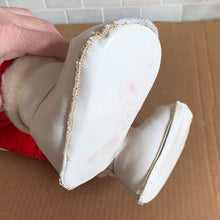 Load image into Gallery viewer, This rare adorable vintage mid-century era large rubber faced Santa Claus stuffed toy features a smiling side eyed face, a sheared velour red suit bordered with white plush trim, black vinyl belt, white velour hands, white vinyl-type blanket stitched boots. Crafted by the Rushton Company, USA, 1950s. A wonderful piece of Christmas nostalgia!

In as found vintage condition. The stitching on the boots have been repaired and could benefit from additional repair. Original tag.

Measures 13 1/2 x 24 1/2 inches
