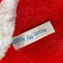 Load image into Gallery viewer, This rare adorable vintage mid-century era large rubber faced Santa Claus stuffed toy features a smiling side eyed face, a sheared velour red suit bordered with white plush trim, black vinyl belt, white velour hands, white vinyl-type blanket stitched boots. Crafted by the Rushton Company, USA, 1950s. A wonderful piece of Christmas nostalgia!

In as found vintage condition. The stitching on the boots have been repaired and could benefit from additional repair. Original tag.

Measures 13 1/2 x 24 1/2 inches
