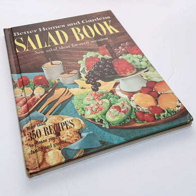 Better Homes and Gardens is known for its fabulous cookbooks. This hardcover cookbook focuses on salad inspired recipes. Its 160 pages are filled with amazing  recipes along with many colour photographs. Originally published by Meredith Corporation, USA, 1965. This is the fifth printing, 1969.   In great vintage condition with normal age-related yellowing.