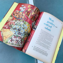 Load image into Gallery viewer, Better Homes and Gardens is known for its fabulous cookbooks. This hardcover cookbook focuses on salad inspired recipes. Its 160 pages are filled with amazing  recipes along with many colour photographs. Originally published by Meredith Corporation, USA, 1965. This is the fifth printing, 1969.   In great vintage condition with normal age-related yellowing.
