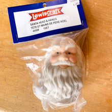 Load image into Gallery viewer, Attention doll makers and crafters! New old stock, vintage porcelain Santa Claus doll head and hands. Made for Lewiscraft in China, circa 1990s. Part number 44588. Whip up a sweet Santa to feature in your Christmas decor!
