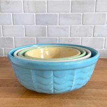 Load image into Gallery viewer, Vintage set of four ceramic 308 mixing bowls, with an exterior pattern of horizontal waves in yellow, mint green, white and robin&#39;s egg blue. Crafted by Robinson Ransbottom Pottery Co., USA, 1960s. A beautiful set to add to your kitchen art pottery collection!

In excellent condition, no chips/cracks/repairs, manufacturer&#39;s glaze pops. Maker&#39;s marks, number 308.
