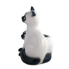 Load image into Gallery viewer, Adorable vintage mid-century era Siamese cat ceramic planter. Crafted by Elbro, Japan, 1950s. Perfect for a small houseplant, air plant or repurpose to hold cat treats or accessories.

In excellent condition, no chips/cracks. Maker&#39;s mark on the bottom.

Measures 5 1/2 x 5 x 7 inches

