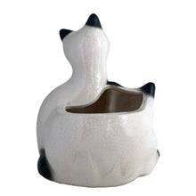 Load image into Gallery viewer, Adorable vintage mid-century era Siamese cat ceramic planter. Crafted by Elbro, Japan, 1950s. Perfect for a small houseplant, air plant or repurpose to hold cat treats or accessories.

In excellent condition, no chips/cracks. Maker&#39;s mark on the bottom.

Measures 5 1/2 x 5 x 7 inches
