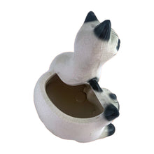 Load image into Gallery viewer, Adorable vintage mid-century era Siamese cat ceramic planter. Crafted by Elbro, Japan, 1950s. Perfect for a small houseplant, air plant or repurpose to hold cat treats or accessories.

In excellent condition, no chips/cracks. Maker&#39;s mark on the bottom.

Measures 5 1/2 x 5 x 7 inches

