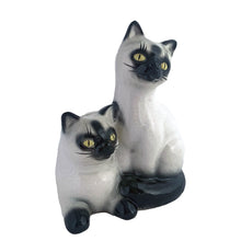 Load image into Gallery viewer, Adorable vintage mid-century era Siamese cat ceramic planter. Crafted by Elbro, Japan, 1950s. Perfect for a small houseplant, air plant or repurpose to hold cat treats or accessories.

In excellent condition, no chips/cracks. Maker&#39;s mark on the bottom.

Measures 5 1/2 x 5 x 7 inches
