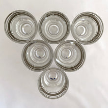 Load image into Gallery viewer, Set of six vintage mid-century era silver banded and rimmed shot glasses. Libbey Glass, USA, 1960s. Add some Hollywood Regency glam to your barware collection with these beauties!

Good vintage condition, no chips, minor wear to the silver.

Measures 1 7/8 x 2 1/4 inches

Capacity 1 ounce
