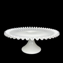 Load image into Gallery viewer, This vintage milk glass Silver Crest round cake stand features a classic clear crimped edge. Crafted by Fenton Art Glass, USA, between 1942 - 1986. A stunning example of mid-century tableware that will always be in style no matter your decor style! An elegant way to present cakes and desserts whether for everyday entertaining, a wedding or bridal shower!

In excellent condition, no chips. Unmarked.

Measures 13 x 5 inches
