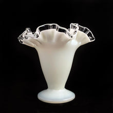 Load image into Gallery viewer, A classic piece of glass artistry, this vintage &quot;Silver Crest&quot; footed milk glass bud vase features a clear double crimped edge. Crafted by Fenton Art Glass, USA, pre-1970.  An elegant and charming piece that will be enjoyed for years to come.  In excellent condition, free from chips. Unmarked, pre-1970.  Measures approximately 4 1/2 x 4 1/8 inches
