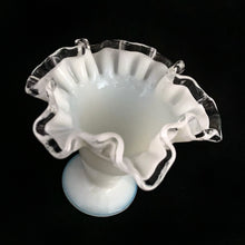 Load image into Gallery viewer, A classic piece of glass artistry, this vintage &quot;Silver Crest&quot; footed milk glass bud vase features a clear double crimped edge. Crafted by Fenton Art Glass, USA, pre-1970.  An elegant and charming piece that will be enjoyed for years to come.  In excellent condition, free from chips. Unmarked, pre-1970.  Measures approximately 4 1/2 x 4 1/8 inches
