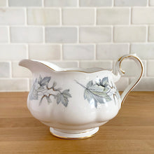 Load image into Gallery viewer, Royal Albert Silver Maple gravy boat, fine bone china, Made in England – front view showing maple leaf motif and gold trim
