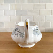 Load image into Gallery viewer, Handle view of Royal Albert Silver Maple pattern – grey maple leaf motif with hand-painted 22k gold trim on fine bone china
