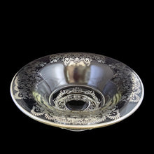 Load image into Gallery viewer, This striking vintage clear glass console bowl with silver overlay is a simply stunning. The silver overlay was produced by the Silver City Glass Co., circa 1940s. This generous sized console bowl. It will elevate any occasion to a special one. A beautiful addition to any collection and a lovely way to add a touch of vintage charm to your home. Would make a spectacular wedding gift! In excellent condition, free from chips, silver is intact. Measures 12 1/4 x 4 1/2 inches
