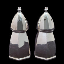 Load image into Gallery viewer, Experience the luxurious beauty of these vintage silver plate salt and pepper shakers, crafted in a classic hexagonal shape with a domed top. Created by Benedict-Proctor Manufacturing Co. in Canada during the 1920s, these shakers have been expertly polished to reveal their stunning resemblance to the &#39;Bishop&#39; chess piece. Elevate your tablescape with their regal and shining presence!  In excellent vintage condition.   Each shaker measures 1 1/4 x 2 3/4 inches
