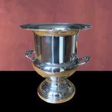Load image into Gallery viewer, Elegant vintage silver plate champagne ice bucket with decorative handles. Use as intended or repurpose as a vase for a spectacular floral arrangement or set prop. Suited to Hollywood glam, Victorian, cottage core decor. In used vintage condition, see photos. Makers mark on the bottom. Measures 8 7/8 x 10 inches
