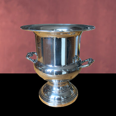 Elegant vintage silver plate champagne ice bucket with decorative handles. Use as intended or repurpose as a vase for a spectacular floral arrangement or set prop. Suited to Hollywood glam, Victorian, cottage core decor. In used vintage condition, see photos. Makers mark on the bottom. Measures 8 7/8 x 10 inches