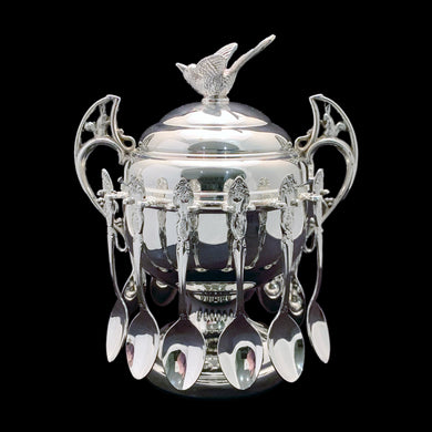 Indulge in nostalgia with this stunning Victorian-style antique silver plate covered sugar bowl. The bowl features a charming figural bird on the lid and intricately designed  handles with figural rabbits. With room for twelve teaspoons, it's perfect for hosting and creates an excellent conversation piece for guests. Crafted by the renowned Wm. A. Rogers Silversmiths, this piece is a true testament to the beauty of fine craftsmanship.