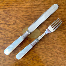 Load image into Gallery viewer, Antique EPNS silver plate fork and knife set featuring Mother-of-Pearl handles with locking royal blue velvet lined golden oak wood box, includes 3 keys. Crafted by Harrison Brothers &amp; Howson, England, circa 1890s. A gorgeous set of cutlery perfect for dessert and fruit service.

In excellent vintage condition, freshly polished. Phillips Montreal appraisal certificate included.

Fork measures 6 1/8 inches
Knife measures 7 1/2 inches
Box measures 11 1/4 x 9 1/4 inches
