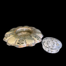Load image into Gallery viewer, This lovely vintage silver plated flower vessel is ornately engraved with florals, decorative swirls, leaves and pierced details. Crafted by Essay Silversmiths, Canada 1950s. With the glass flower frog you&#39;ll be able to create a beautiful centrepiece.

Silver vessel is in vintage condition. Glass frog in excellent condition, no chips.

Vessel measures 6 3/8 x 2 1/4 inches (interior bowl diameter of 2 1/2 inches)

Glass frog measures 3 1/4 x 1 3/8 inches
