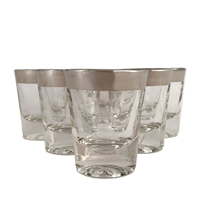 Set of six vintage mid-century era silver banded shot glasses in the style of Dorothy Thorpe. Add some Hollywood Regency glam to your barware collection with these beauties!

In good vintage condition, free from chips/cracks, minor wear to the silver. Maker unknown.

Measures 1 7/8 x 2 1/4 inches

Capacity 1 ounce