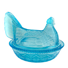 Load image into Gallery viewer, This highly collectible aqua blue pressed glass hen-on-nest is spectacular! Crafted by the Westmoreland Glass Company, USA. Use it as a trinket, soap, catchall, candy or nut dish...or whatever you wish. Makes a fantastic easter decor piece and suits any style....shabby chic, cottage, farmhouse, industrial and we dare say, modern! In excellent condition, no chips or cracks. Marked with embossed WG 1949-1984. Measures 7 1/2 x 5 7/8 x 6 1/4 inches

