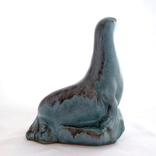 Load image into Gallery viewer, Vintage seal perched on rocks redware figurine, finished in slate blue drip glaze with a matte finish. Crafted by Blue Mountain Pottery, Canada, circa 1970s. A beautiful and highly collectible piece of pottery from this iconic brand! Excellent condition, free from chips/cracks/repairs. Measures 5 3/4 x 4 x 7 1/2 inches
