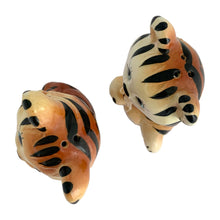 Load image into Gallery viewer, Vintage anthropomorphic smiling tiger ceramic salt and pepper shakers with ribbon collars. Crafted in Japan and imported by Enterprise. These adorable shakers will make a wonderful addition to your kitsch collection and kitchen decor!  In excellent condition, free from chips/cracks/repairs. Enterprise sticker and plastic stoppers present.  Measures 2 3/8 x 1 7/8 x 4 inches
