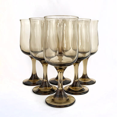 Set of six vintage smokey brown Connoisseur wine glasses. Crafted by Libbey Glass, USA, 1980s. These elegantly shaped vessels are sure to add elegance to any tablescape and display beautifully on a bar cart. Cheers!

Measures 2 7/8 x 7 1/4 inches

Capacity 12 ounces