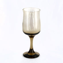 Load image into Gallery viewer, Set of six vintage smokey brown Connoisseur wine glasses. Crafted by Libbey Glass, USA, 1980s. These elegantly shaped vessels are sure to add elegance to any tablescape and display beautifully on a bar cart. Cheers!

Measures 2 7/8 x 7 1/4 inches

Capacity 12 ounces
