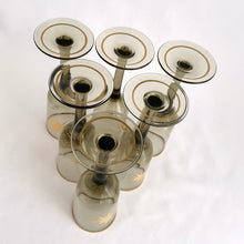 Load image into Gallery viewer, Gorgeous set of six vintage mid-century modern smokey brown liquor glasses decorated with atomic gold stars and rims.  In excellent condition, free from chips/wear.  Measures 1 3/4 x 5 1/8 inchesGorgeous set of six vintage mid-century modern smokey brown liquor glasses decorated with atomic gold stars and rims.  In excellent condition, free from chips/wear.  Measures 1 3/4 x 5 1/8 inches
