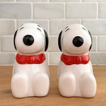 Load image into Gallery viewer, Vintage retro Snoopy character ceramic salt and pepper shakers with plastic stoppers. B&amp;M Inc., Taiwan, 1970s. Add these adorable and highly collectible shakers to your collection!

In excellent vintage condition, no chips/cracks/repairs. Maker&#39;s mark and sticker.

Measures 2 1/4 x 2 3/4 x 3 3/4 inches
