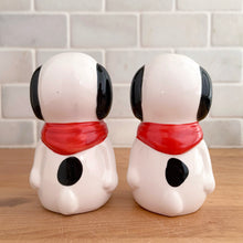 Load image into Gallery viewer, Vintage retro Snoopy character ceramic salt and pepper shakers with plastic stoppers. B&amp;M Inc., Taiwan, 1970s. Add these adorable and highly collectible shakers to your collection!

In excellent vintage condition, no chips/cracks/repairs. Maker&#39;s mark and sticker.

Measures 2 1/4 x 2 3/4 x 3 3/4 inches
