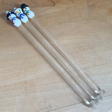 Load image into Gallery viewer, Set of three delightful hand blown snowman topped clear cocktail swizzle sticks. Perfect to brighten your holiday drinks!

In excellent condition.

Measures 7 3/4 inches
