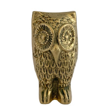 Load image into Gallery viewer, Front view of vintage solid brass owl figurine showing engraved circular eyes, beak, and feather texture, aged golden patina, 1970s Taiwan
