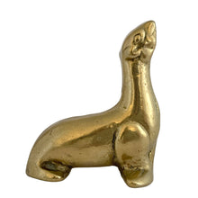 Load image into Gallery viewer, Right-side profile of vintage solid brass seal figurine in upright seated pose with head tilted back, aged golden patina, 1970s Taiwan
