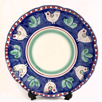 Gorgeous vintage Solimene chicken serving plate produced by Vietri for Target, circa 2007. Made in Italy. This playful pottery is decorated with white chickens against cobalt blue, greenery, red dots along the edge and bands of red and green in the centre all on a white ground.  In good vintage condition. Minor chip to the rim and a manufacturer's defect on the back. Please see photos.  Measures 13 1/2 x 1 3/4 inches