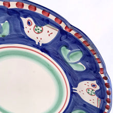 Load image into Gallery viewer, Gorgeous vintage Solimene chicken serving plate produced by Vietri for Target, circa 2007. Made in Italy. This playful pottery is decorated with white chickens against cobalt blue, greenery, red dots along the edge and bands of red and green in the centre all on a white ground.  In good vintage condition. Minor chip to the rim and a manufacturer&#39;s defect on the back. Please see photos.  Measures 13 1/2 x 1 3/4 inches
