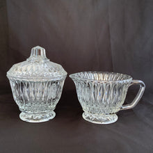 Load image into Gallery viewer, This Vintage &quot;LRS45 Clear&quot; creamer and lidded sugar from Libbey Glass Company boasts a stunning diamond pattern that brilliantly reflects the light!  In excellent condition, free from chips.  Creamer measures 3 5/8 x 2 3/4 inches  Lidded sugar measures 3 5/8 x 4 1/4 inches
