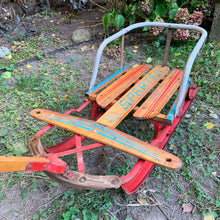 Load image into Gallery viewer, Classic vintage mid-century Spartan child&#39;s pull snow sleigh or sled. This one features a steel frame with red metal skis, wood slat deck and steering bar, metal backrest and long wood handle with red metal hand grip. Crafted by Werlich Industries, Canada, 1960s. Bring back all the wonderful of snowy winter days with this beloved wee sled!

In as found vintage condition with wear to the entire piece commensurate with use and age. Original sticker present.
