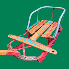 Load image into Gallery viewer, Classic vintage mid-century Spartan child&#39;s pull snow sleigh or sled. This one features a steel frame with red metal skis, wood slat deck and steering bar, metal backrest and long wood handle with red metal hand grip. Crafted by Werlich Industries, Canada, 1960s. Bring back all the wonderful of snowy winter days with this beloved wee sled!

In as found vintage condition with wear to the entire piece commensurate with use and age. Original sticker present.
