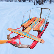 Load image into Gallery viewer, Classic vintage mid-century Spartan child&#39;s pull snow sleigh or sled. This one features a steel frame with red metal skis, wood slat deck and steering bar, metal backrest and long wood handle with red metal hand grip. Crafted by Werlich Industries, Canada, 1960s. Bring back all the wonderful of snowy winter days with this beloved wee sled!

In as found vintage condition with wear to the entire piece commensurate with use and age. Original sticker present.
