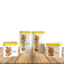 Load image into Gallery viewer, Vintage &quot;Spice of Life&quot; four piece metal stackable kitchen canister set featuring white canisters with yellow lids and the distinctive vegetables of this pattern. Each has period style typography in black printed letters flour, sugar, coffee and tea. Crafted by J. Chein &amp; Co., USA, circa 1960s. Perfect for the retro kitchen enthusiast! 
