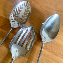 Load image into Gallery viewer, Detail of the solid measuring spoon showing graduated markings from 1 teaspoon to 1 tablespoon and side pouring spout
