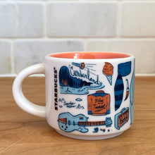 Load image into Gallery viewer, This sweet Starbucks collectible TENNESSEE mini ceramic mug Christmas ornament from the Been There Series Across the Globe Collection, 2016. This white mug depicting all things Tennessee in shades of yellow, orange and blue with yellow interior. Celebrate the The Big Bend State with an espresso!

In excellent condition, free from chips/cracks/wear.

Measures 2 3/8 x 1 7/8 inches

Capacity 2 ounces
