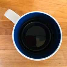 Load image into Gallery viewer, Perfect for your morning cuppa joe to make you feel like a world traveller! This fabulous collectible UNITED ARAB EMIRATES ceramic mug was produced by Starbucks as part of their &quot;YOU ARE HERE&quot; collection, 2018. A white ceramic mug printed design in shades of pink, blue, red and yellow with blue interior. Celebrate the Make it Happen country!

In excellent condition, free from chips/cracks/wear.

Measures 3 5/8 x 3 3/8 inches

Capacity 14 ounces
